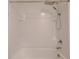 White tiled tub and shower combination with modern shower head at 16805 Delia St, Wimauma, FL 33598