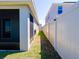 Well-maintained side yard with privacy fence offering a clean outdoor space at 16805 Delia St, Wimauma, FL 33598