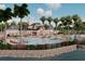 Luxurious community pool area with ample seating, palm trees, and resort-style amenities at 18051 Foxtail Loop, Venice, FL 34293