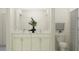 Bright bathroom featuring a double vanity, marble countertop, white cabinetry, and a shower with a curtain at 18448 Serene Lake Loop, Lutz, FL 33548