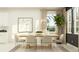 Bright dining room with modern table set and beautiful decor, perfect for Gathering meals or entertaining guests at 18448 Serene Lake Loop, Lutz, FL 33548