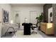 Stylish home office with a desk, chairs, plant, and decor to create an inviting workspace at 18448 Serene Lake Loop, Lutz, FL 33548