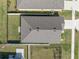 An aerial view of a house featuring a roof, fenced yard and green grass at 2232 Harris Hawk, Ruskin, FL 33570