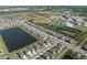 Aerial shot of residential community showcasing houses and a sports complex with baseball, football, and swimming facilities at 2232 Harris Hawk, Ruskin, FL 33570