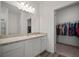 Bright bathroom featuring wood-look floors, a shower, and access to the closet at 2232 Harris Hawk, Ruskin, FL 33570
