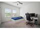 Bright bedroom with ceiling fan, carpet, and large windows at 2232 Harris Hawk, Ruskin, FL 33570