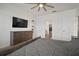 Comfortable bedroom featuring a ceiling fan, a dresser with TV, and closet access at 2232 Harris Hawk, Ruskin, FL 33570