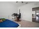 Bright bedroom with ceiling fan, carpet, and access to computer area at 2232 Harris Hawk, Ruskin, FL 33570
