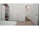 Bright bedroom features neutral carpet and large shelving unit at 2232 Harris Hawk, Ruskin, FL 33570