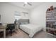 Cozy bedroom with ceiling fan, neutral carpet, and large shelving unit at 2232 Harris Hawk, Ruskin, FL 33570