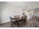 Dining area, openly connected to kitchen, with a view of the backyard and a seating capacity for six at 2232 Harris Hawk, Ruskin, FL 33570