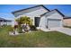 Attractive single-Gathering home with a two-car garage and well-manicured lawn, complete with landscape beds at 2232 Harris Hawk, Ruskin, FL 33570