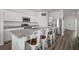 Modern kitchen featuring stainless steel appliances, granite countertops, and a spacious center island at 2232 Harris Hawk, Ruskin, FL 33570