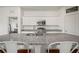 Bright kitchen featuring granite countertops, stainless steel appliances, and ample cabinet space at 2232 Harris Hawk, Ruskin, FL 33570