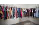 Walk-in closet featuring wall-to-wall clothing racks and carpet flooring at 2232 Harris Hawk, Ruskin, FL 33570
