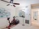Bonus room featuring exercise bike, grey exercise ball, and large wall mirror at 2348 Shelley St # 2, Clearwater, FL 33765