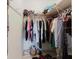 Bedroom walk-in closet with clothes hanging on racks at 2348 Shelley St # 2, Clearwater, FL 33765
