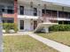 Clean two-story condo exterior with a well-manicured lawn and brick accents at 2348 Shelley St # 2, Clearwater, FL 33765