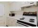 Classic kitchen features white stove, microwave and plenty of counter space at 2348 Shelley St # 2, Clearwater, FL 33765