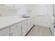 Classic kitchen features ample white cabinets and stainless steel sink at 2348 Shelley St # 2, Clearwater, FL 33765