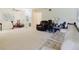 Spacious living room featuring a comfortable sofa, recliner, and bright lighting at 2348 Shelley St # 2, Clearwater, FL 33765