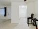 Bright living room features neutral carpet and leads to the kitchen at 2348 Shelley St # 2, Clearwater, FL 33765
