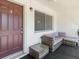 Cozy outdoor patio with comfortable seating, perfect for relaxing, by front door at 2348 Shelley St # 2, Clearwater, FL 33765