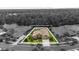 An aerial view showcases the home's position and landscaping on Winged Elm Dr Wesley Chapel, FL at 26920 Winged Elm Dr, Wesley Chapel, FL 33544
