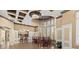 Charming lounge area with kitchenette, bar seating, and comfortable tables, perfect for socializing at 26920 Winged Elm Dr, Wesley Chapel, FL 33544