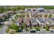 Community aerial view showing a pool, modern buildings, and well-maintained residences at 28642 Tranquil Lake Cir, Wesley Chapel, FL 33543