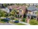 Aerial view of a neighborhood with manicured lawns, palm trees, and inviting home exteriors at 28642 Tranquil Lake Cir, Wesley Chapel, FL 33543