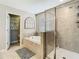 Bathroom showcasing a luxurious tub, a tiled shower, and a window with a view, creating a spa-like experience at 28642 Tranquil Lake Cir, Wesley Chapel, FL 33543
