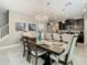 Open-concept dining room with a chandelier, connecting seamlessly to the kitchen at 28642 Tranquil Lake Cir, Wesley Chapel, FL 33543