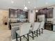 Bright kitchen featuring stainless steel appliances, granite counters, and a large island at 28642 Tranquil Lake Cir, Wesley Chapel, FL 33543