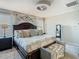 Comfortable main bedroom with ample space, furniture, and large windows for natural light at 28642 Tranquil Lake Cir, Wesley Chapel, FL 33543