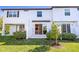 Backyard featuring a patio, grass, and a view of the home's exterior at 2895 Deer Pine Trl, Land O Lakes, FL 34638