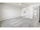 Spacious bedroom with neutral walls and plush gray carpet, ready for personalization at 2895 Deer Pine Trl, Land O Lakes, FL 34638