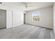 Bright bedroom with a window view, neutral walls, and plush gray carpet at 2895 Deer Pine Trl, Land O Lakes, FL 34638