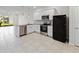 Modern kitchen featuring stainless steel appliances, granite countertops, and white cabinetry at 2895 Deer Pine Trl, Land O Lakes, FL 34638