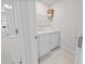 Laundry room featuring a washer, dryer, and wire shelf at 2895 Deer Pine Trl, Land O Lakes, FL 34638
