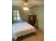 Bedroom with a comfortable bed, ceiling fan, and a guitar case at 2910 Lichen Ln # B, Clearwater, FL 33760