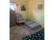 Bright bedroom featuring a twin mattress, dresser, train art and a rocking chair at 2910 Lichen Ln # B, Clearwater, FL 33760