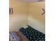 Bedroom showing a bed and yellow walls at 2910 Lichen Ln # B, Clearwater, FL 33760
