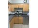 Kitchen with stainless sink, dish rack and ample wooden cabinets at 2910 Lichen Ln # B, Clearwater, FL 33760