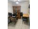 Office space with a wooden desk, hutch, and tile flooring at 2910 Lichen Ln # B, Clearwater, FL 33760