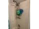 Shower space features a shower head, shower caddy, and white tile at 2910 Lichen Ln # B, Clearwater, FL 33760