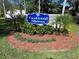 Eastwood Shores community sign surrounded by landscaping and flowers at 2910 Lichen Ln # B, Clearwater, FL 33760