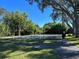 Community tennis courts surrounded by lush landscaping and trees at 2910 Lichen Ln # B, Clearwater, FL 33760