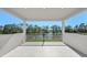 Covered balcony offers relaxing views of the lake at 33736 Ocean Spray Ln, Wesley Chapel, FL 33543