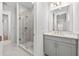 Modern bathroom featuring a glass enclosed shower with marble tiling and updated vanity at 33736 Ocean Spray Ln, Wesley Chapel, FL 33543